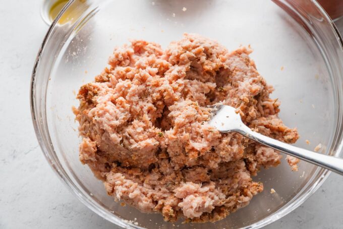 Ground chicken added to meatball mixture.