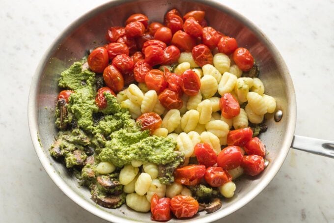 Gnocchi and tomatoes added alongside pesto and mushrooms.