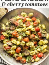 Tender gnocchi pair perfectly with basil pesto and oven-charred cherry tomatoes for an amazing meal ready to eat in 25 minutes!