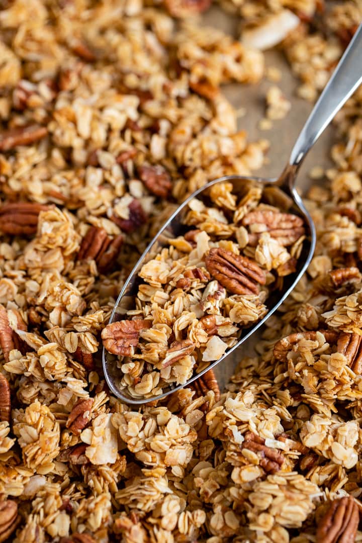 Close-up of a scoop of coconut pecan granola.