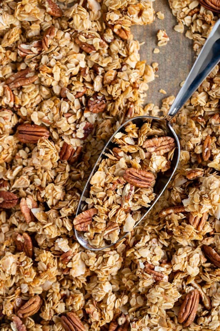 Baking tray filled with coconut pecan granola.