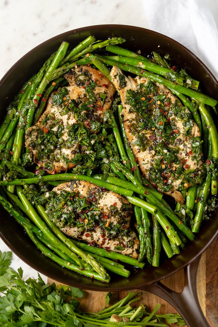Close-up of chimichurri chicken in skillet.