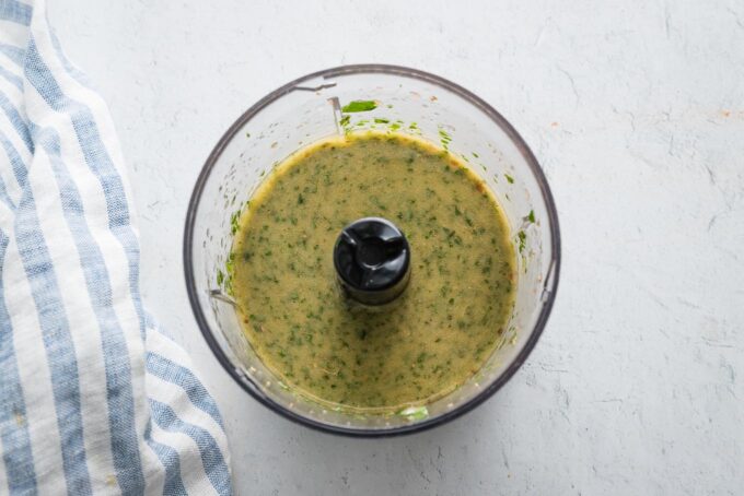 Homemade chimichurri sauce blended in a mini food processor.