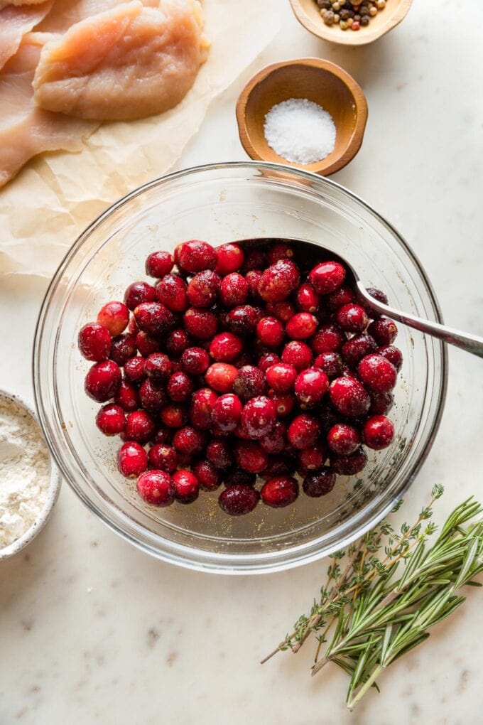 Cranberries marinating in brown sugar and balsamic vinegar.