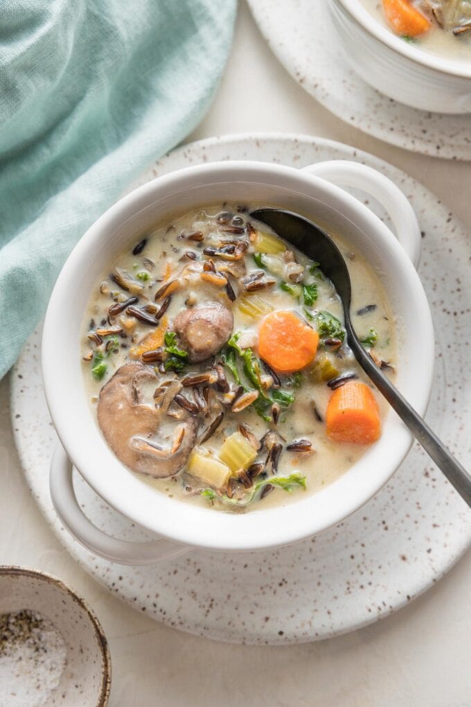 Small soup bowl filled with a creamy Instant Pot wild rice soup.
