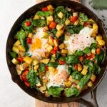 A crispy potato and egg breakfast skillet cooked in cast iron.