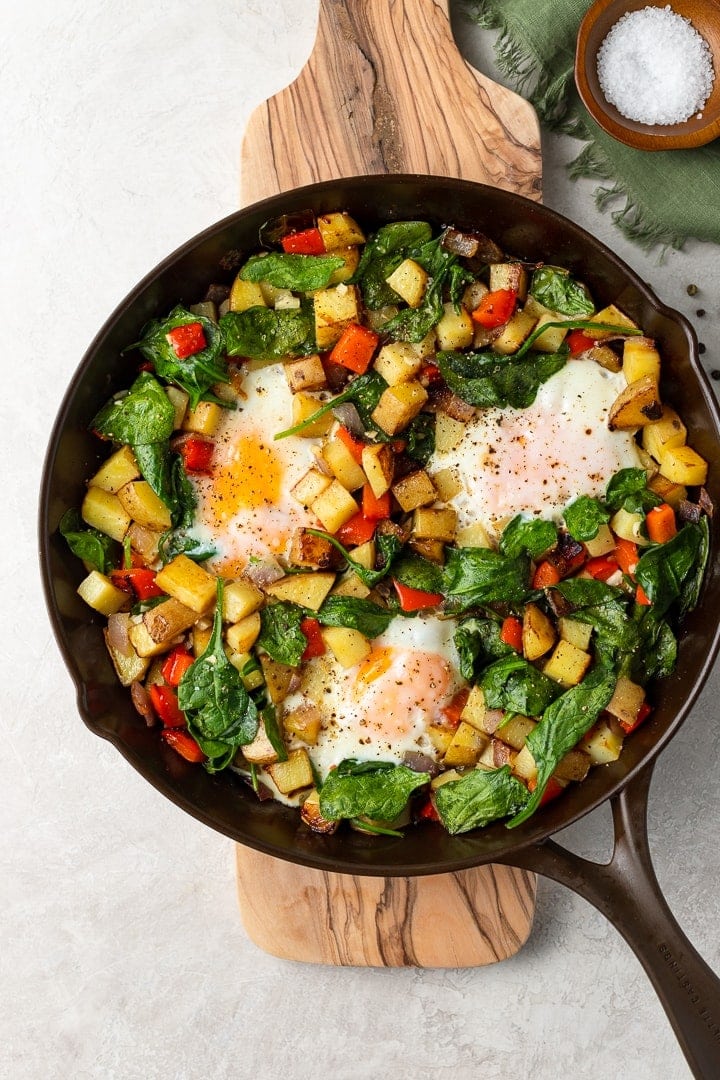 A crispy potato and egg breakfast skillet cooked in cast iron.