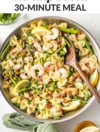 A bright dish of lemon asparagus pasta perked up with shrimp and crunchy pistachios. Ready in less than 30 minutes, perfect for busy weeknights!