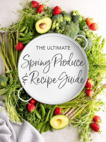 White tray surrounded by produce, with letters "The Ultimate Spring Produce and Recipe Guide"
