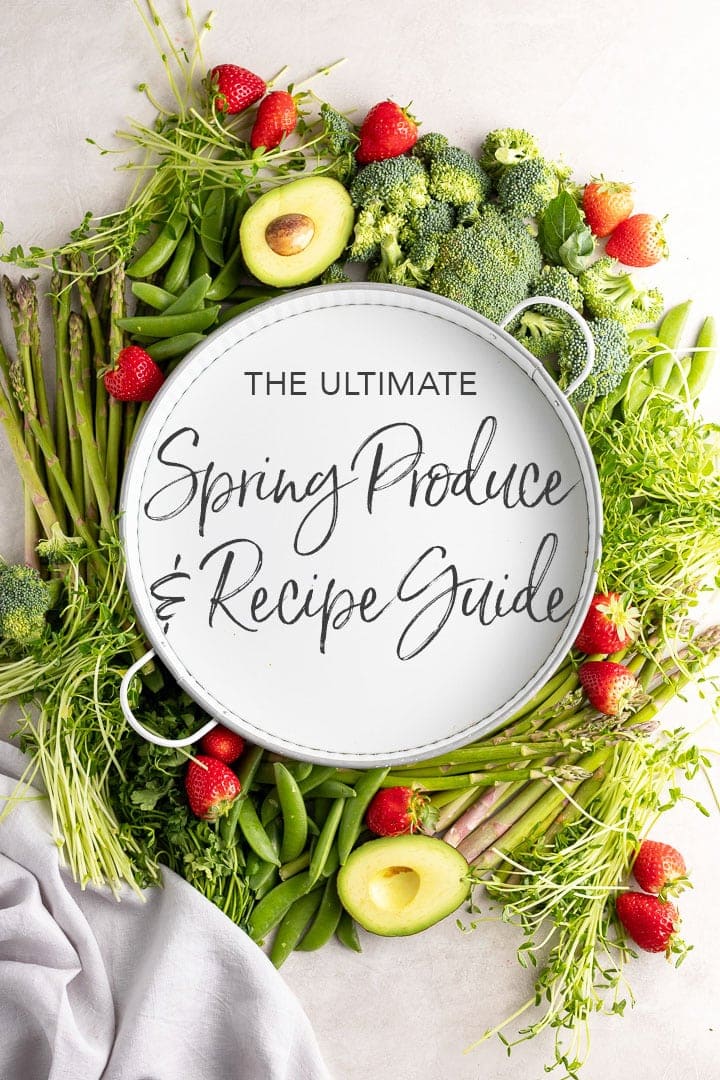 White tray surrounded by produce, with letters "The Ultimate Spring Produce and Recipe Guide"