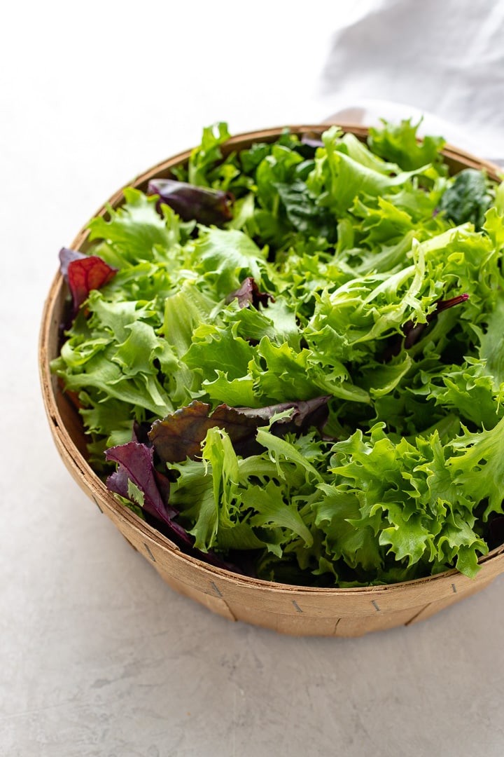 Close-up of lettuce leaves in a basket.