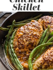 This simple recipe produces juicy, flavorful Honey Mustard Chicken seared and baked in the most delicious pan sauce. You'll love this fool-proof method for perfectly cooked chicken breasts and green beans together in a healthy, easy, one-skillet meal.