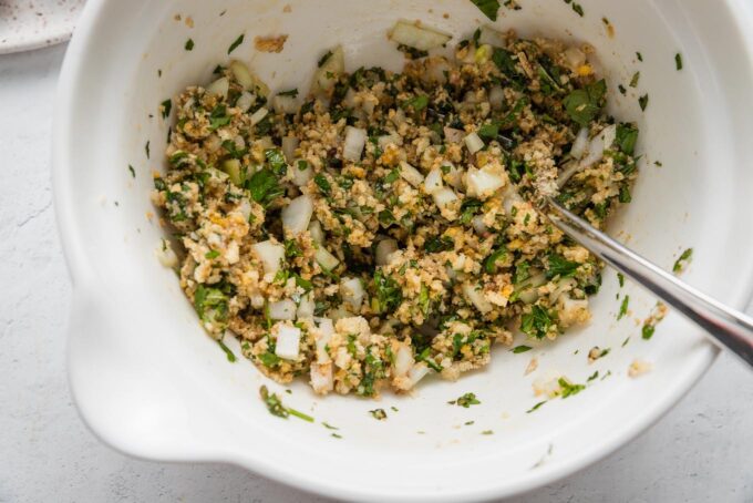 Panko, egg and egg whites, onion, and fresh herbs mixed together as a meatball base.