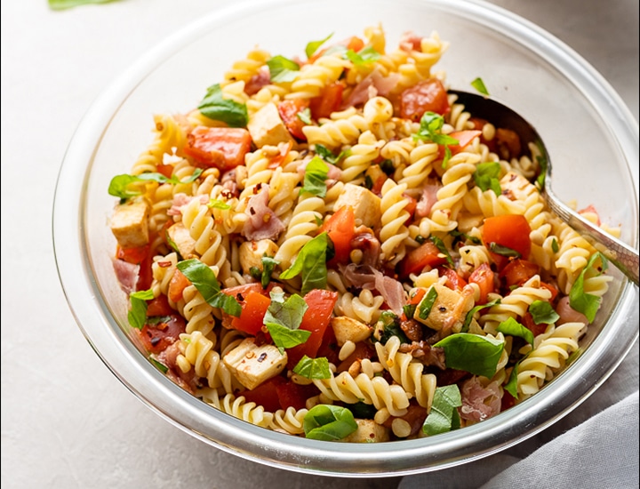 Finished dish of Caprese Pasta Salad.