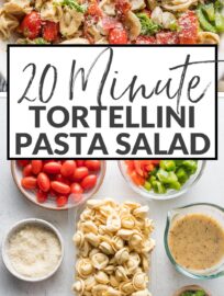 Close up of a bowl full of tortellini pasta salad loaded with peppers, pepperoni, tomatoes, mozzarella, and Italian dressing.