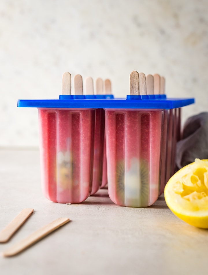 Homemade strawberry kiwi popsicles in the popsicle mold.