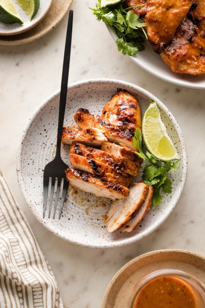Sliced chicken breast on a small plate ready to eat.