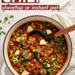 Saving to make this in August!! Zucchini, peppers, and corn infuse this Summer Vegetable Chili with flavor and make it the perfect late summer meal everyone will love! Stovetop AND Instant Pot instructions included, either works. #instantpot #summer #chili