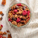 A small jar filled with raspberry chocolate chunk granola.