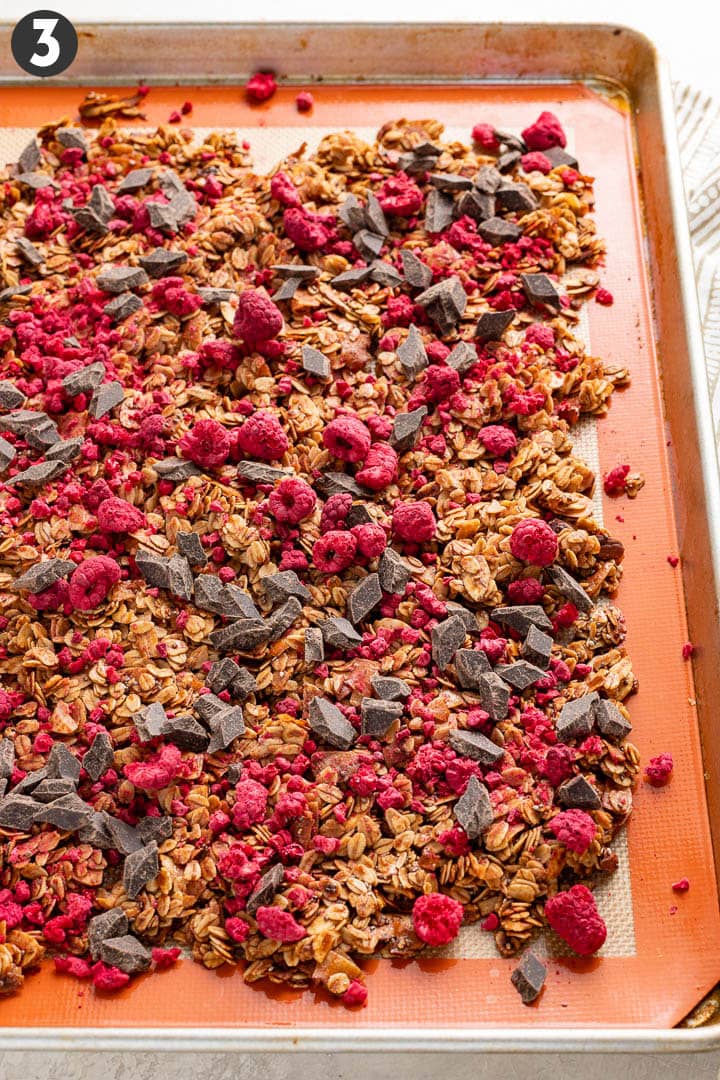 Raspberry chocolate granola, spread out to cool on a baking sheet.