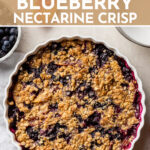 Grab all that fruit while it's still in season! This recipe shows you exactly how to make the best old-fashioned blueberry nectarine crisp, with a thick fruit filling and a warm, crackly, buttery oat topping. Grandma would be so proud! #fruitcrisp #summerdessert #blueberries #nectarines