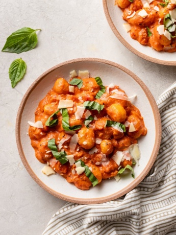 Bowls filled with gnocchi alla vodka.