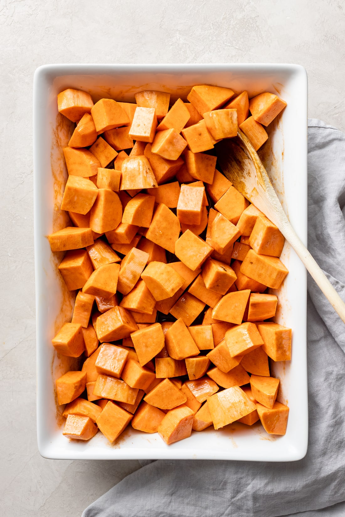 Chopped sweet potatoes, ready to toss and bake.