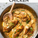 The BEST recipe for creamy garlic chicken! Tender chicken breasts served in a mouth-watering garlic cream sauce with lightly caramelized onions, fragrant thyme, and a squeeze of lemon juice are a winning dinner, every time! Easy to make, too: one skillet, 30 minutes! #chickenrecipes #familyrecipes #familydinners