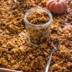 A small jar full of homemade maple pumpkin granola.