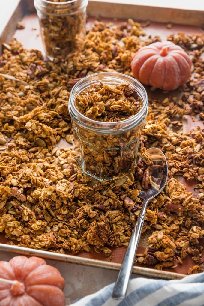 A small jar full of homemade maple pumpkin granola.