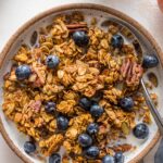 Maple pumpkin granola is a true delight, loaded with real pumpkin, maple syrup, oats, pecan, pumpkin seeds, and plenty of cozy spices. It's also easy to make, naturally vegan and gluten-free, and all-around irresistible. One of my family's most requested fall breakfasts and snacks!