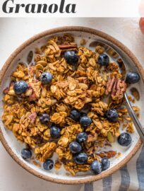 Maple pumpkin granola is a true delight, loaded with real pumpkin, maple syrup, oats, pecan, pumpkin seeds, and plenty of cozy spices. It's also easy to make, naturally vegan and gluten-free, and all-around irresistible. One of my family's most requested fall breakfasts and snacks!