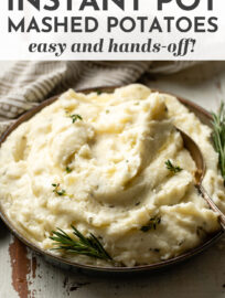 Make mashed potatoes easy and hands-off with this best ever Instant Pot recipe! Fluffy, creamy, and buttery, flavored with delicious garlic and herbs. The Instant Pot keeps them warm until the rest of your meal is ready, so this is the perfect recipe for Thanksgiving or any other time you've got multiple dishes to juggle. #instantpotrecipes #mashedpotatoes