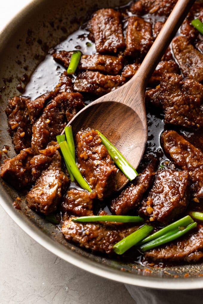 Close up of Mongolian beef in a skillet.