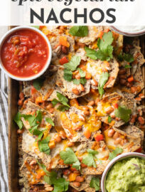 Throw together these epic vegetarian nachos with pinto beans and watch mouths start to water. Takes 20 minutes, the perfect way to feed your favorite crowd. #superbowlsnacks #gamedaysnacks #nachos #appetizers #vegetarian #flexitarian