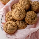 Banana bran muffins piled in a basket.