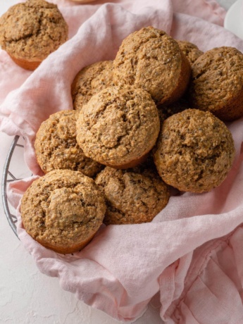 Banana bran muffins piled in a basket.