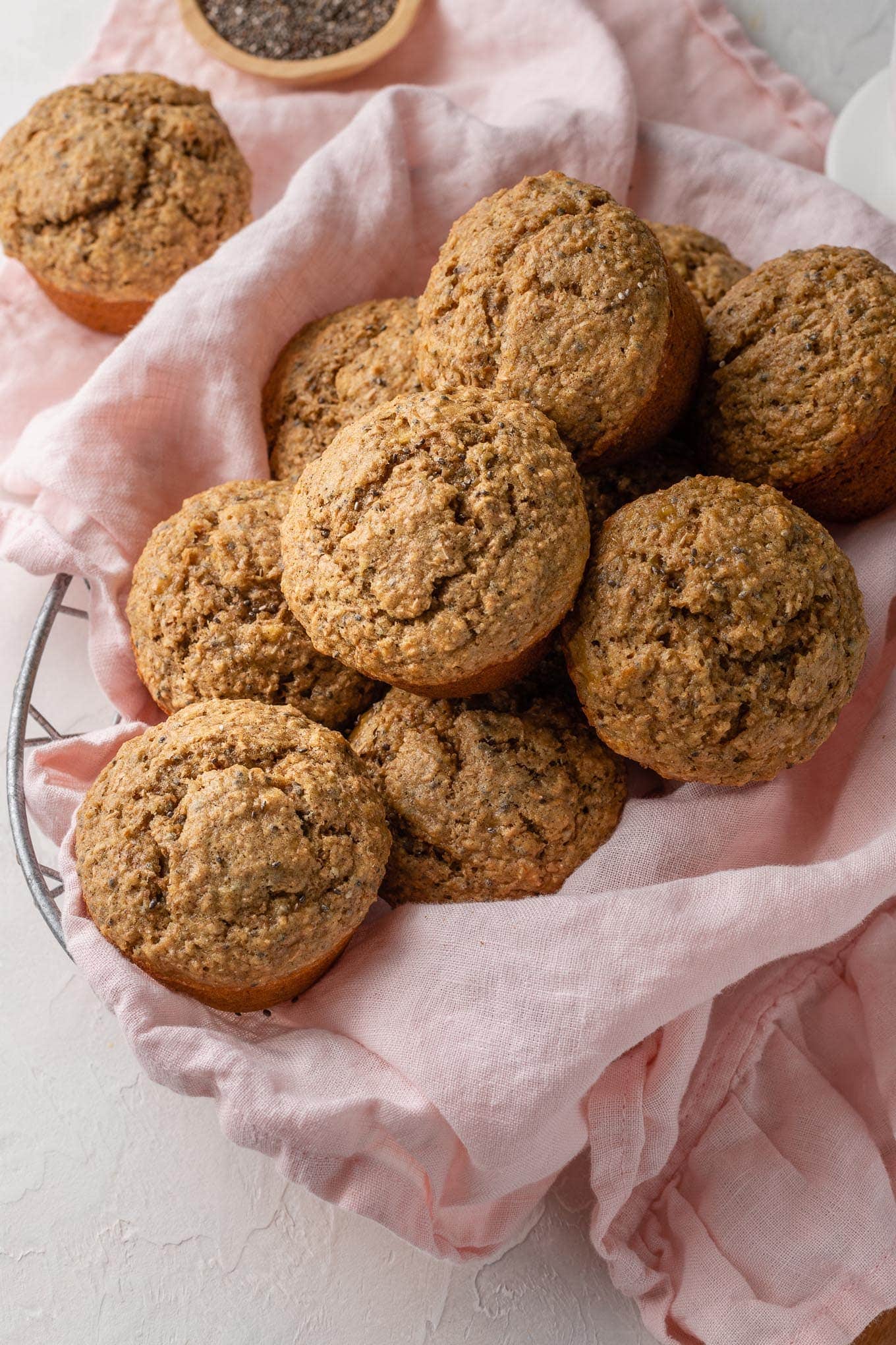 Banana bran muffins piled in a basket.