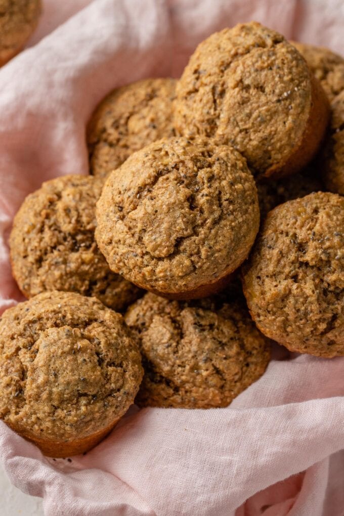 Banana bran muffins piled in a basket.