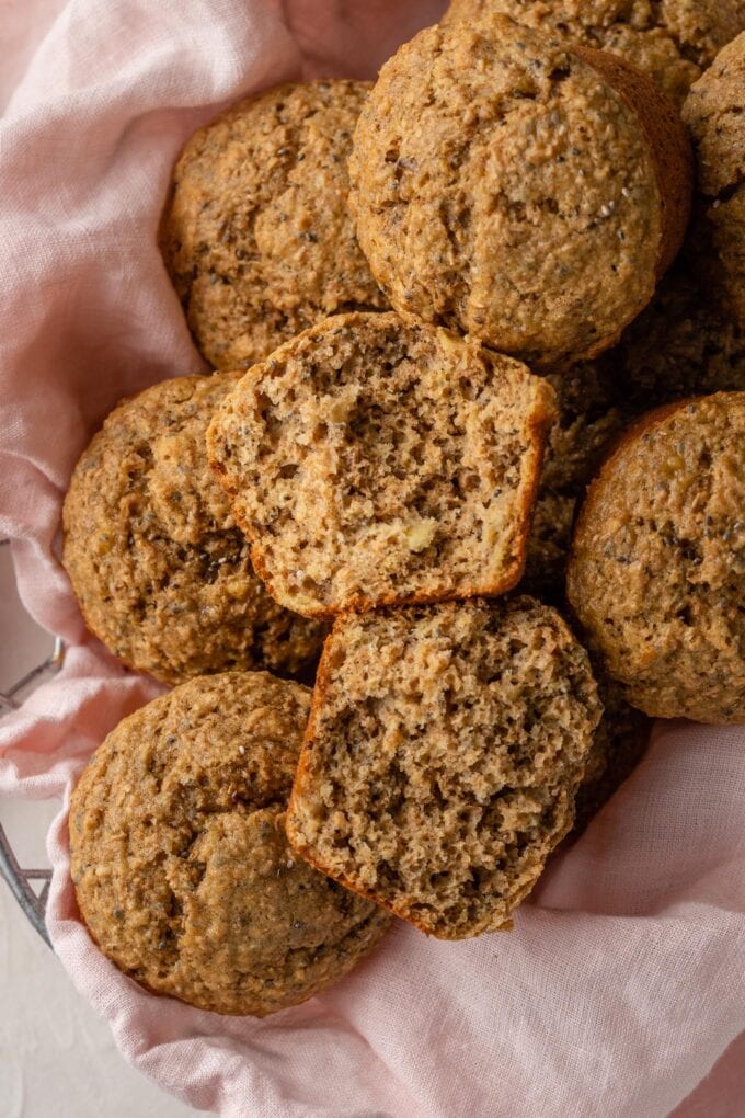 A banana bran muffin pulled in half, ready to eat.