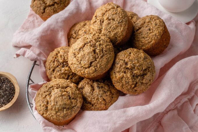 Banana bran muffins piled in a basket.