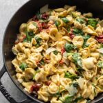 One pan creamy Tuscan tortellini with spinach and sun-dried tomatoes.