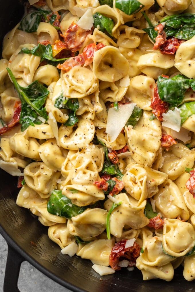 Close up of cooked tortellini in a pan.