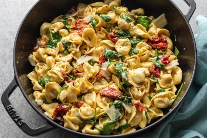 Landscape image of tortellini in pan.