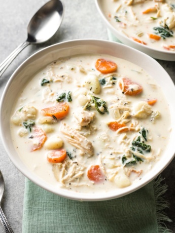 Bowls of creamy crockpot chicken gnocchi, a perfect Olive Garden copycat.