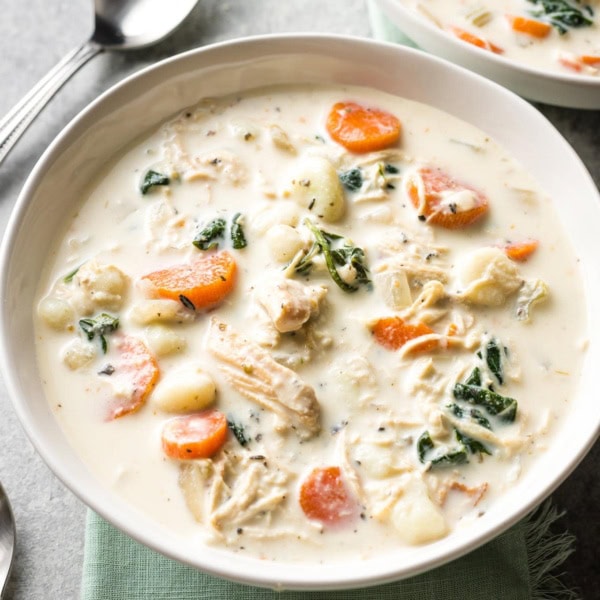 Bowls of creamy crockpot chicken gnocchi, a perfect Olive Garden copycat.