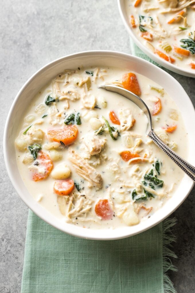 Bowls of creamy crockpot chicken gnocchi, a perfect Olive Garden copycat.