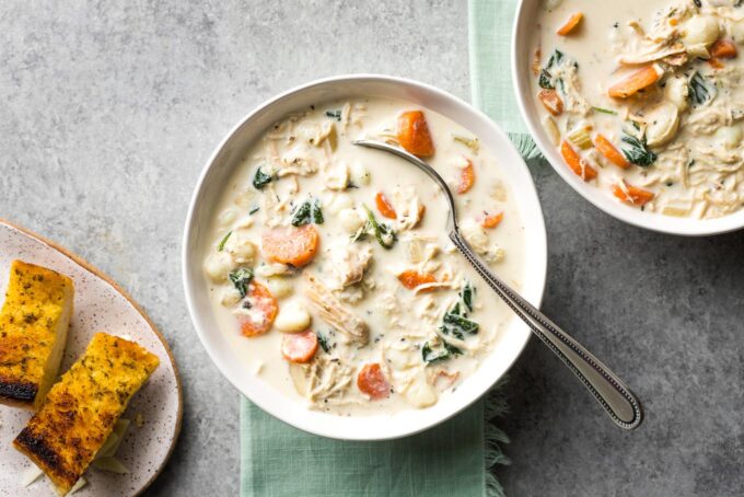 Bowls of creamy crockpot chicken gnocchi, a perfect Olive Garden copycat.