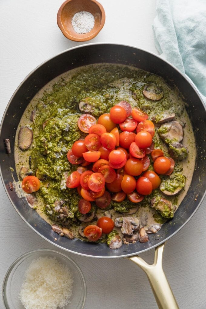 Tomatoes added to sauce for pesto cavatappi.