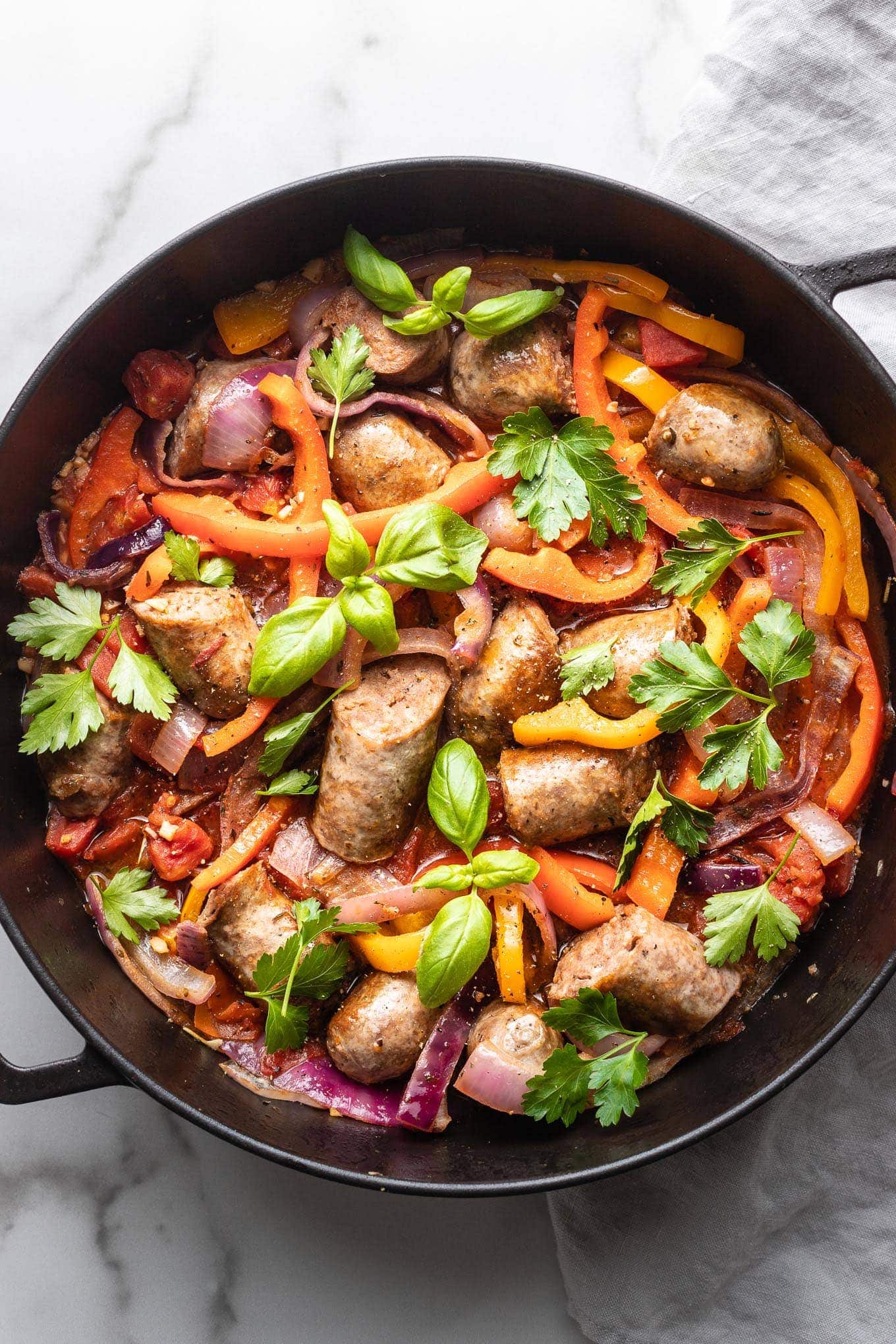 https://www.nourish-and-fete.com/wp-content/uploads/2020/03/italian-sausage-peppers-onions-1360px-2.jpg